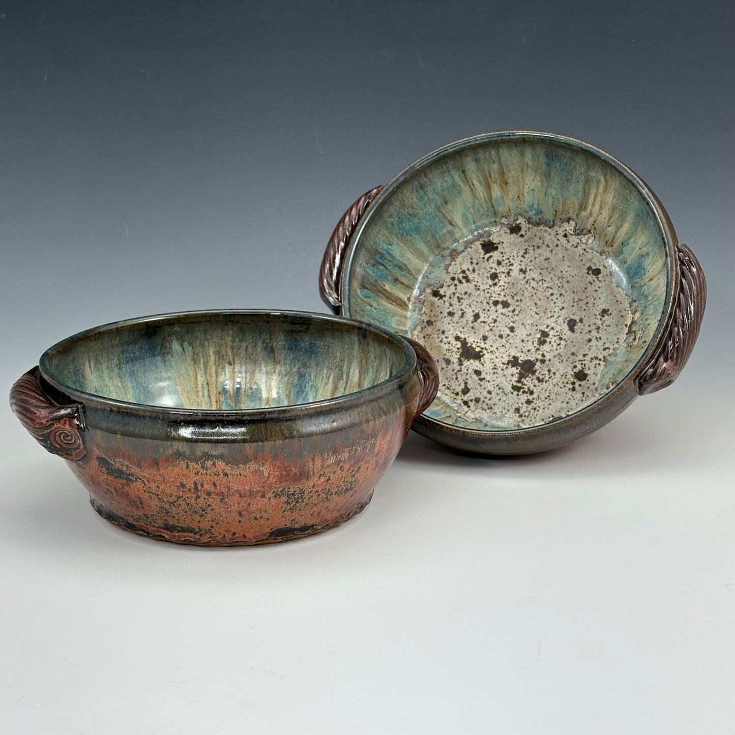 Set of two matching bowls with handles